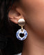 Gold oval stud earrings with hand-painted blue-and-white Talavera heart-cutout circle ceramic drops.
