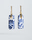 Gold bar-stud earrings with blue-and-white Talavera rectangle ceramic tile drops.