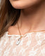 Gold chain necklace with white hand‑painted Talavera teardrop ceramic pendant.