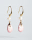 Gold hook earrings with freshwater pearl and blush pink Talavera ceramic teardrop charms.