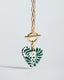 Gold paperclip toggle chain necklace with hand-painted green-and-white Talavera ceramic heart pendant.