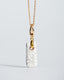 Gold chain necklace with hand‑painted white/gray Talavera rectangle ceramic tile pendant.