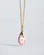 Gold chain necklace with hand‑painted pink Talavera ceramic teardrop pendant.