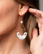 Gold hook geometric earrings with freshwater pearl, triangle frame, and white/gray Talavera ceramic crescent drops.