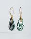 Gold hook earrings with green-and-white Talavera ceramic teardrop drops.