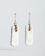Gold bar-stud earrings with white/gray Talavera rectangle ceramic tile drops.